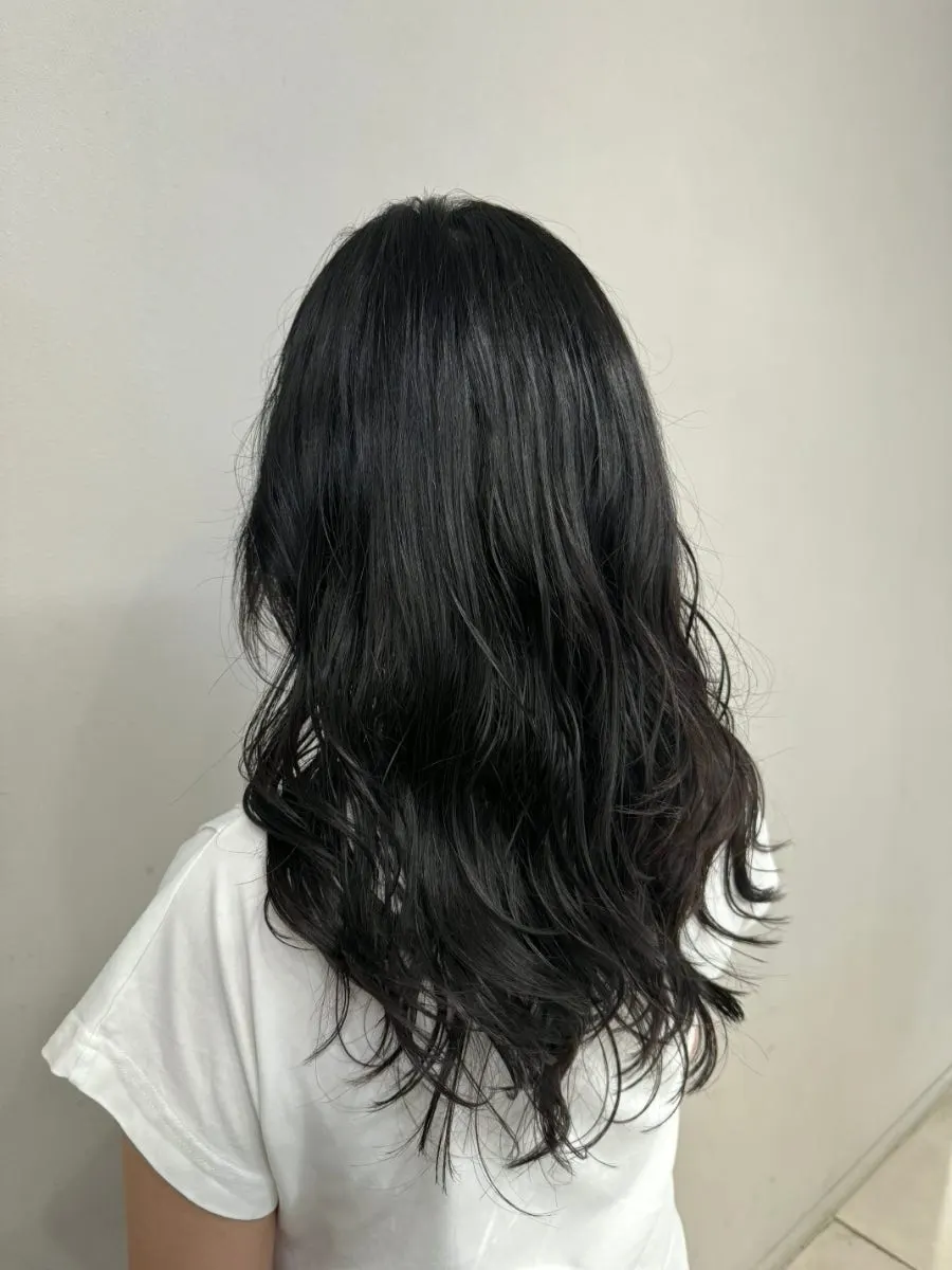 Layered perm style transformed into a lively mood