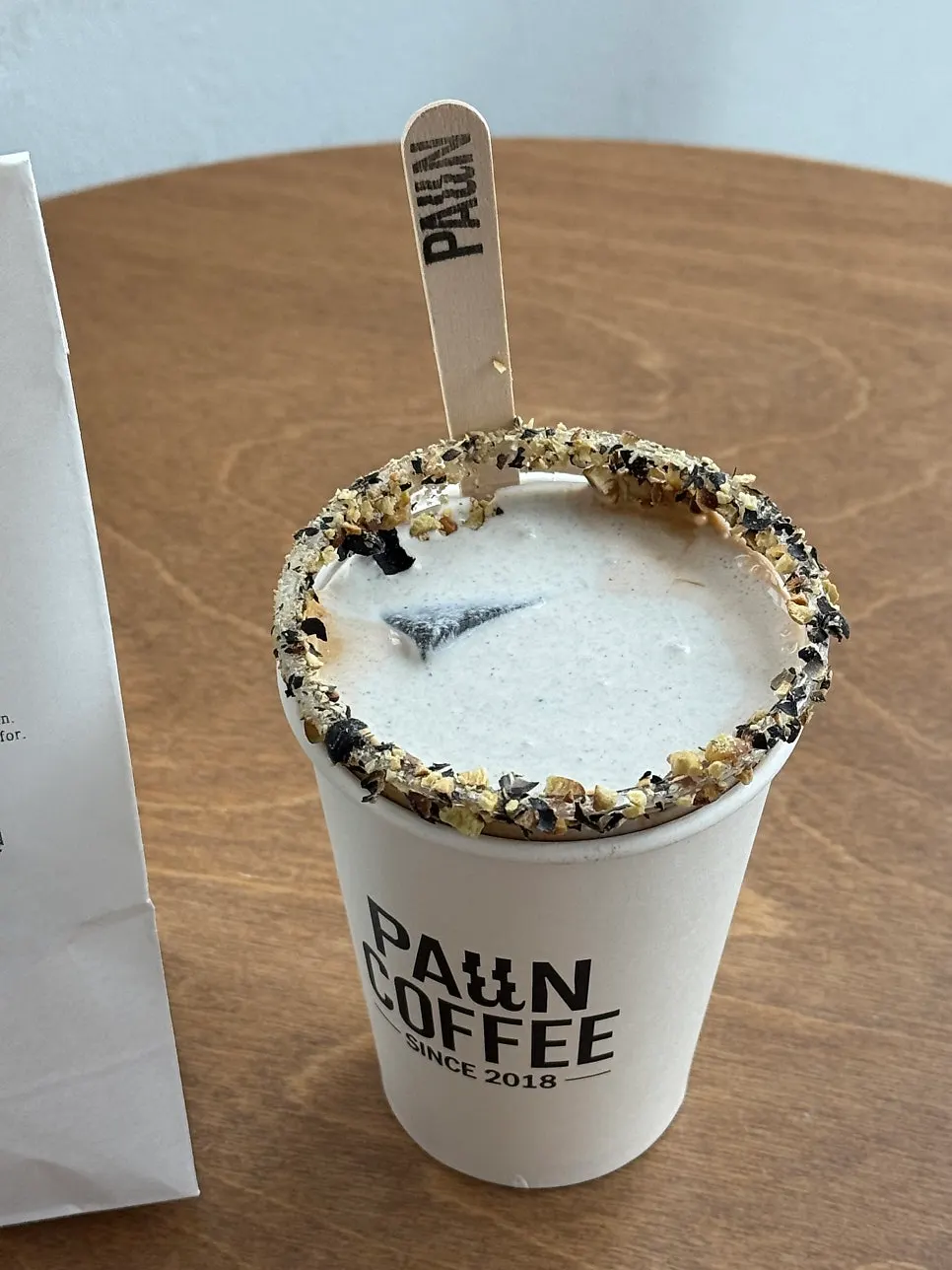 Paju Danjang Bean Cream Latte in a takeout cup