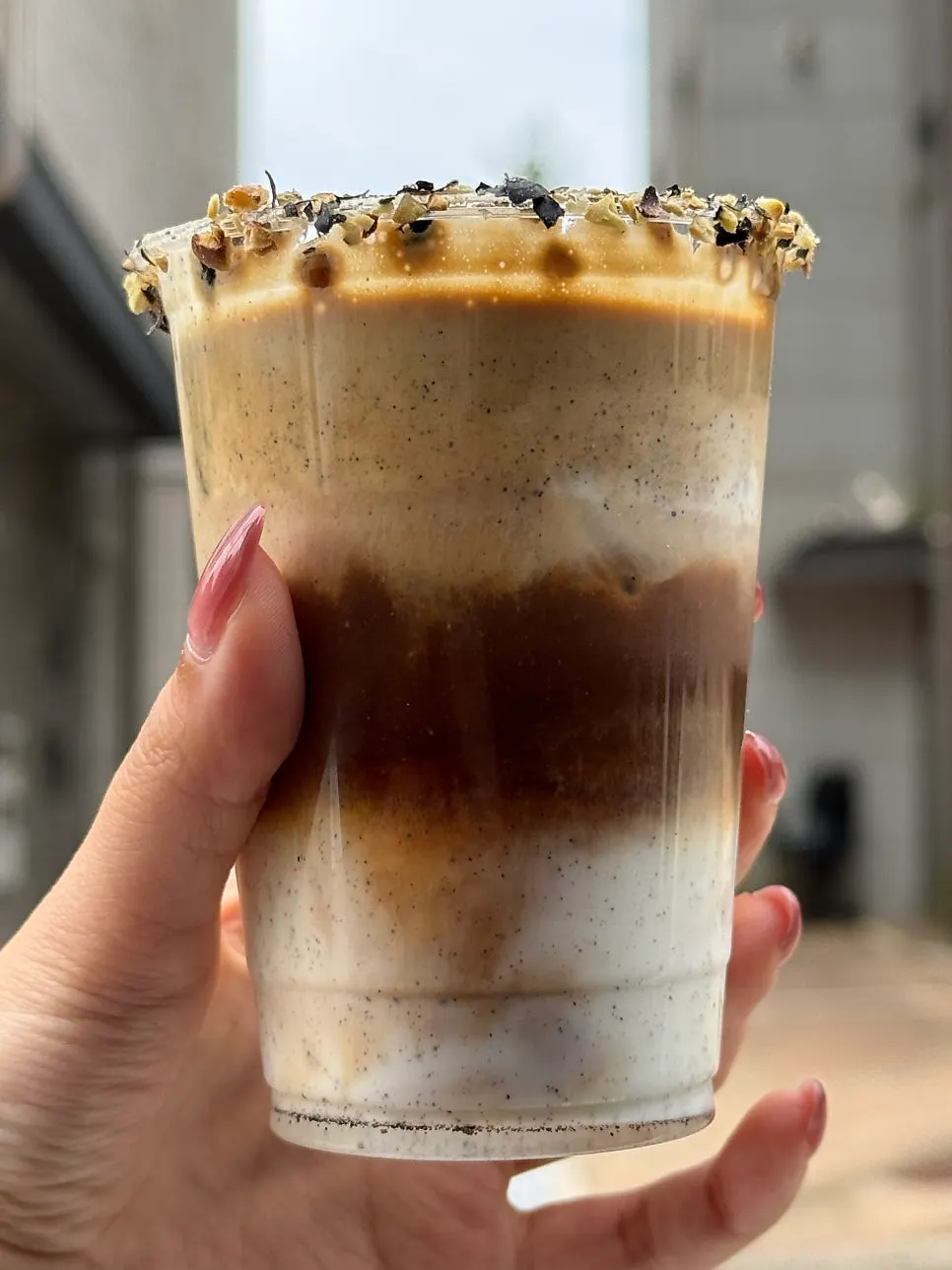Danjang bean cream latte with beans stuck to the cup rim