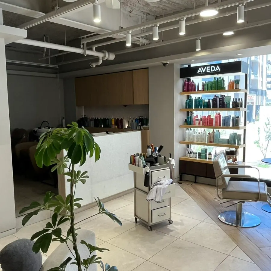 Hair salon interior with floor-to-ceiling windows