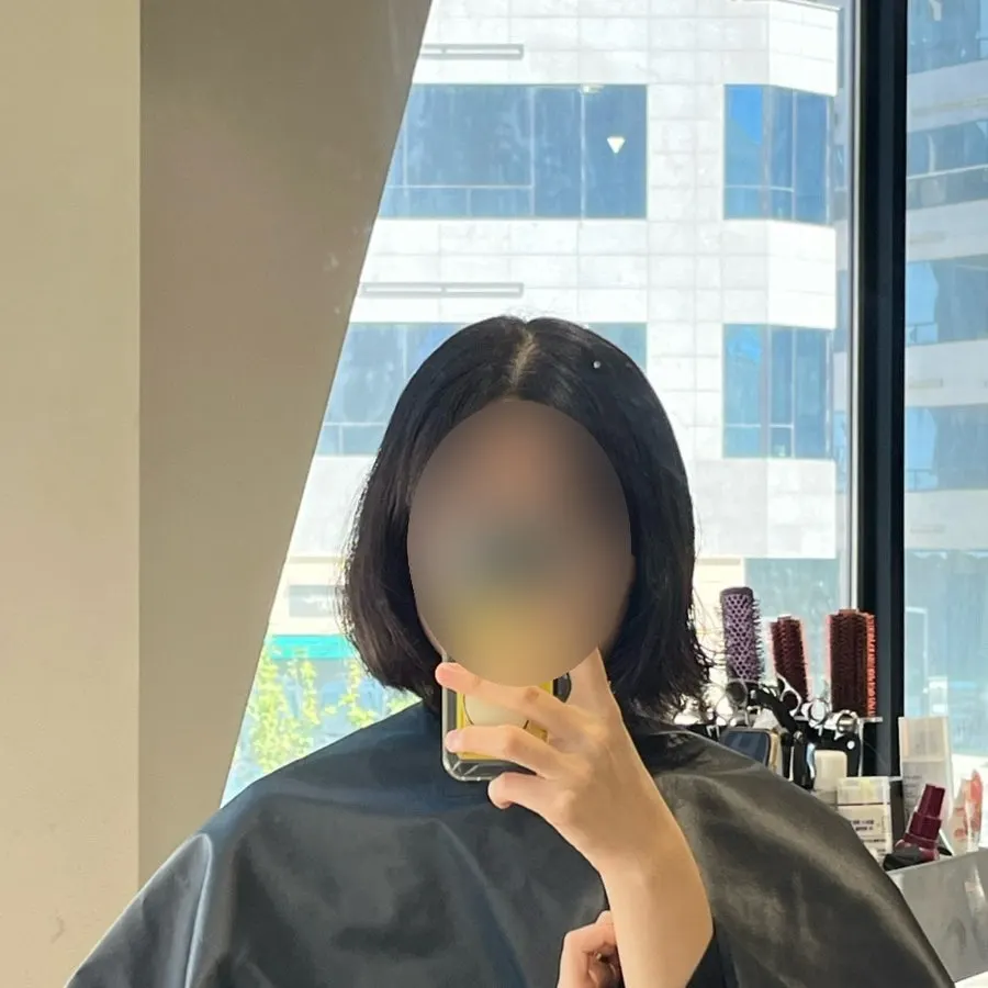 Hair cut to length during the first stage of the short-bob treatment
