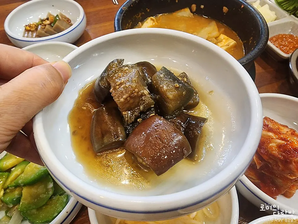Spicy radish salad and kimchi pancake among the banchan