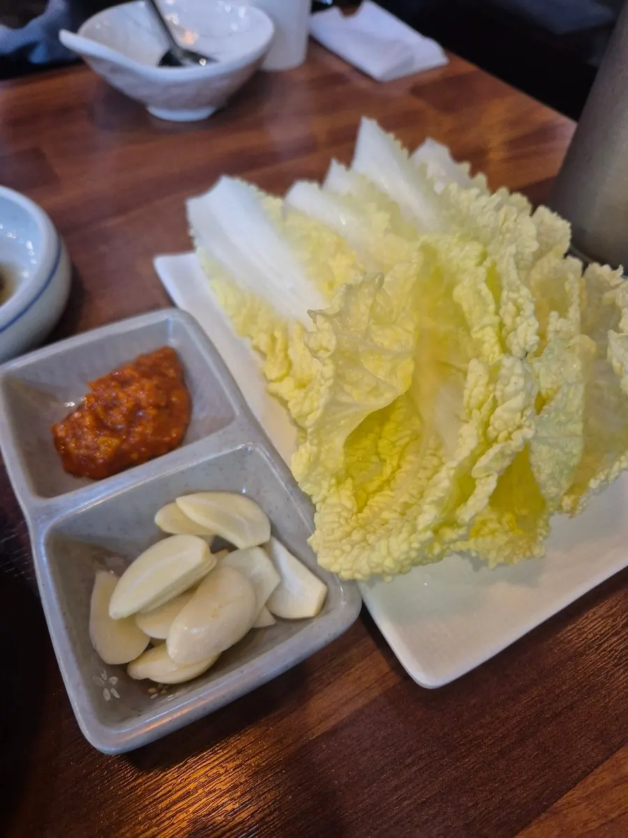 Banchan served alongside the Ttuksim Jjukkumi Rice Table
