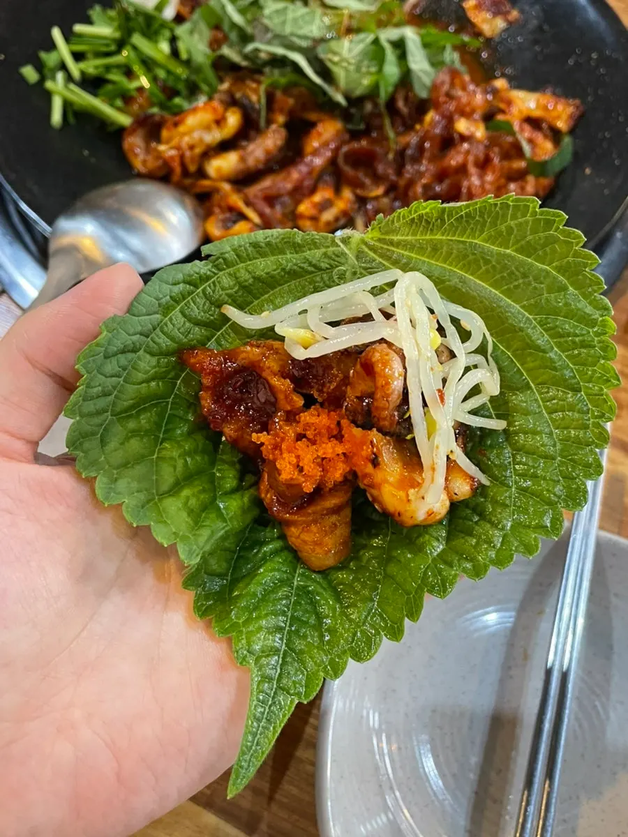 Perilla leaf wrap with Jikhwa Bul Jjuksam and flying fish roe