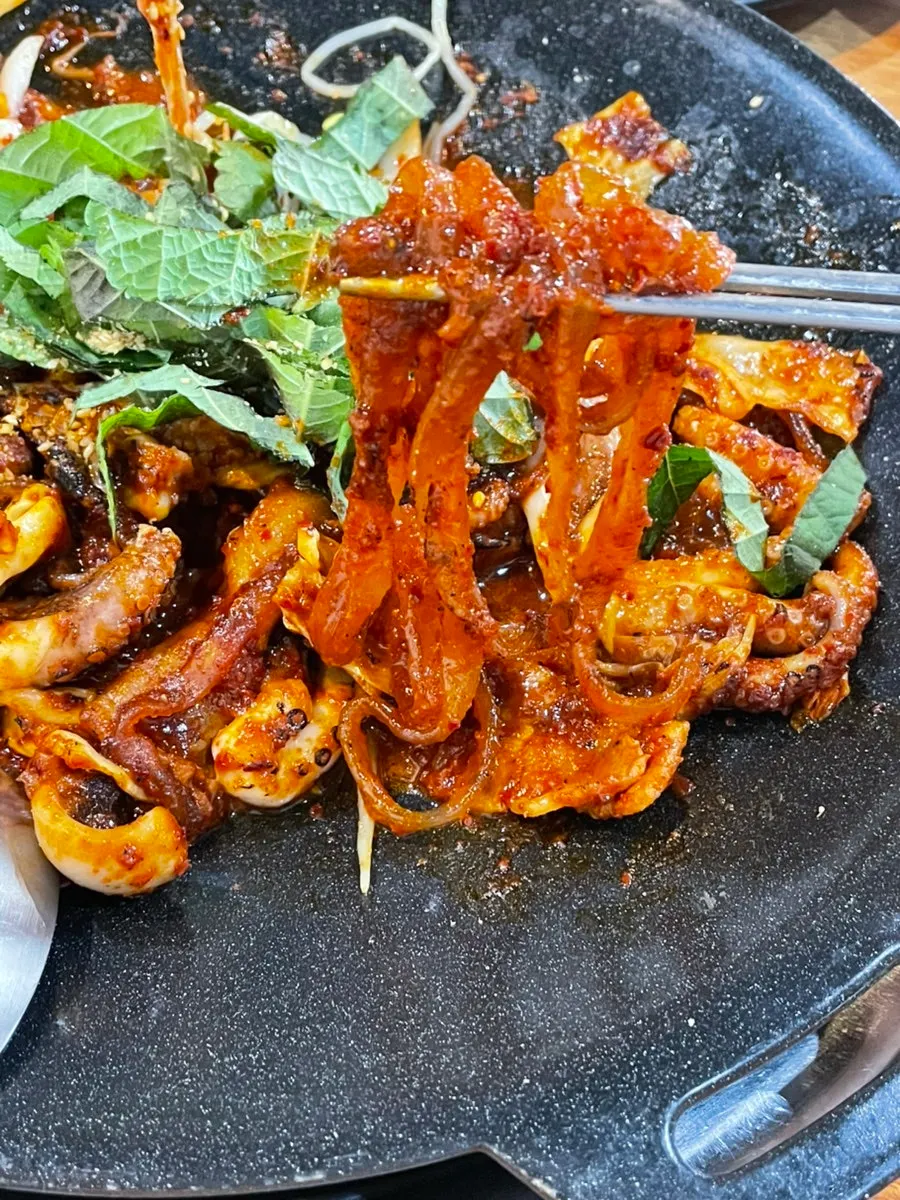 Seasoned glass noodles underneath the griddle dish