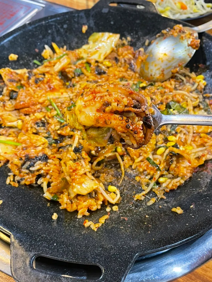 Fried rice being prepared on the griddle