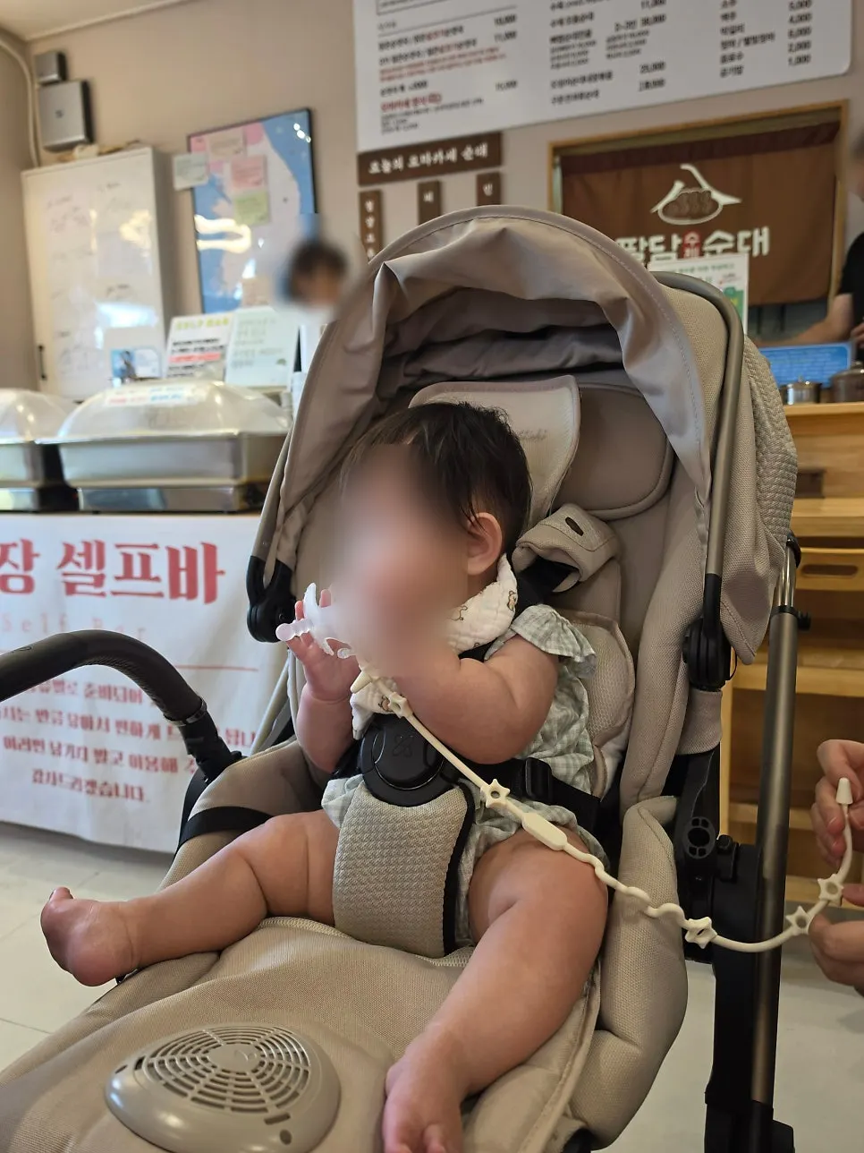 Child sitting quietly at the next seat during the meal