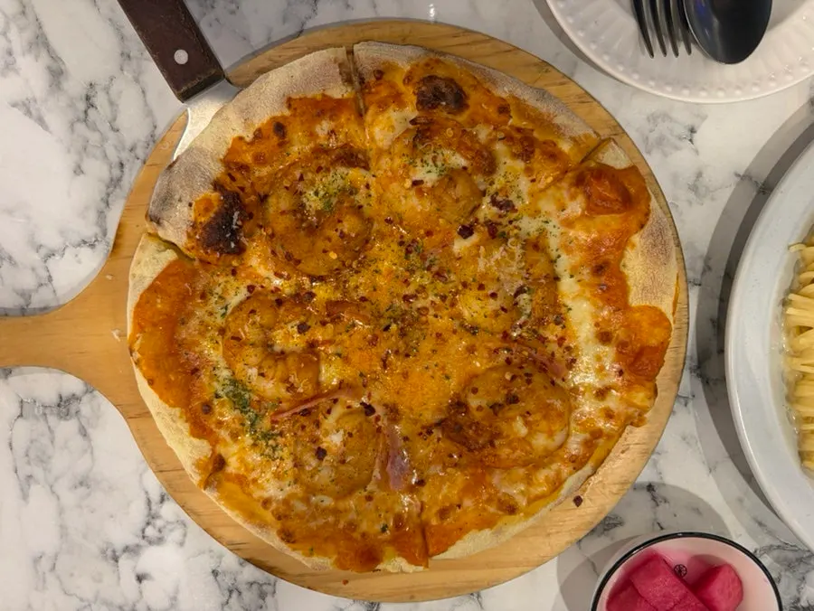 Shrimp rosé pizza topped with king shrimp