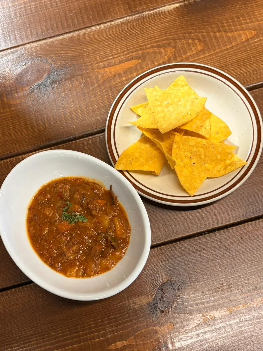 Complimentary nachos and beef chili soup