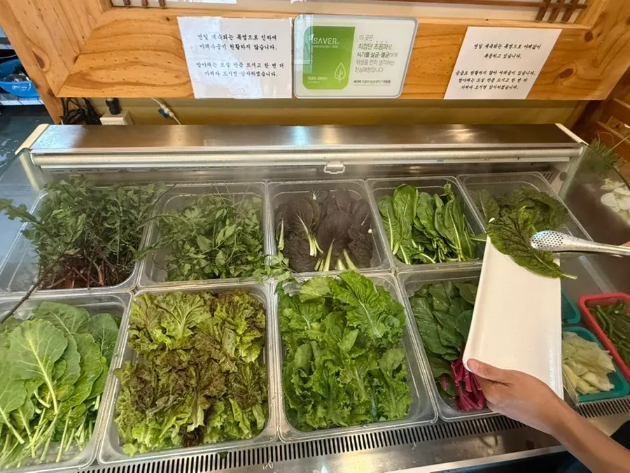 A variety of wrap greens including lettuce and chicory