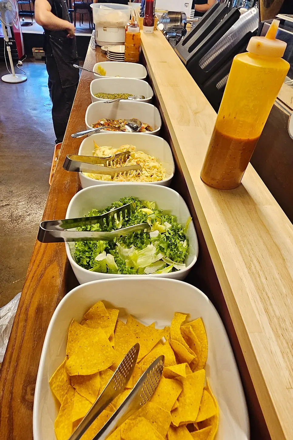 Tortilla and coleslaw self-service bar