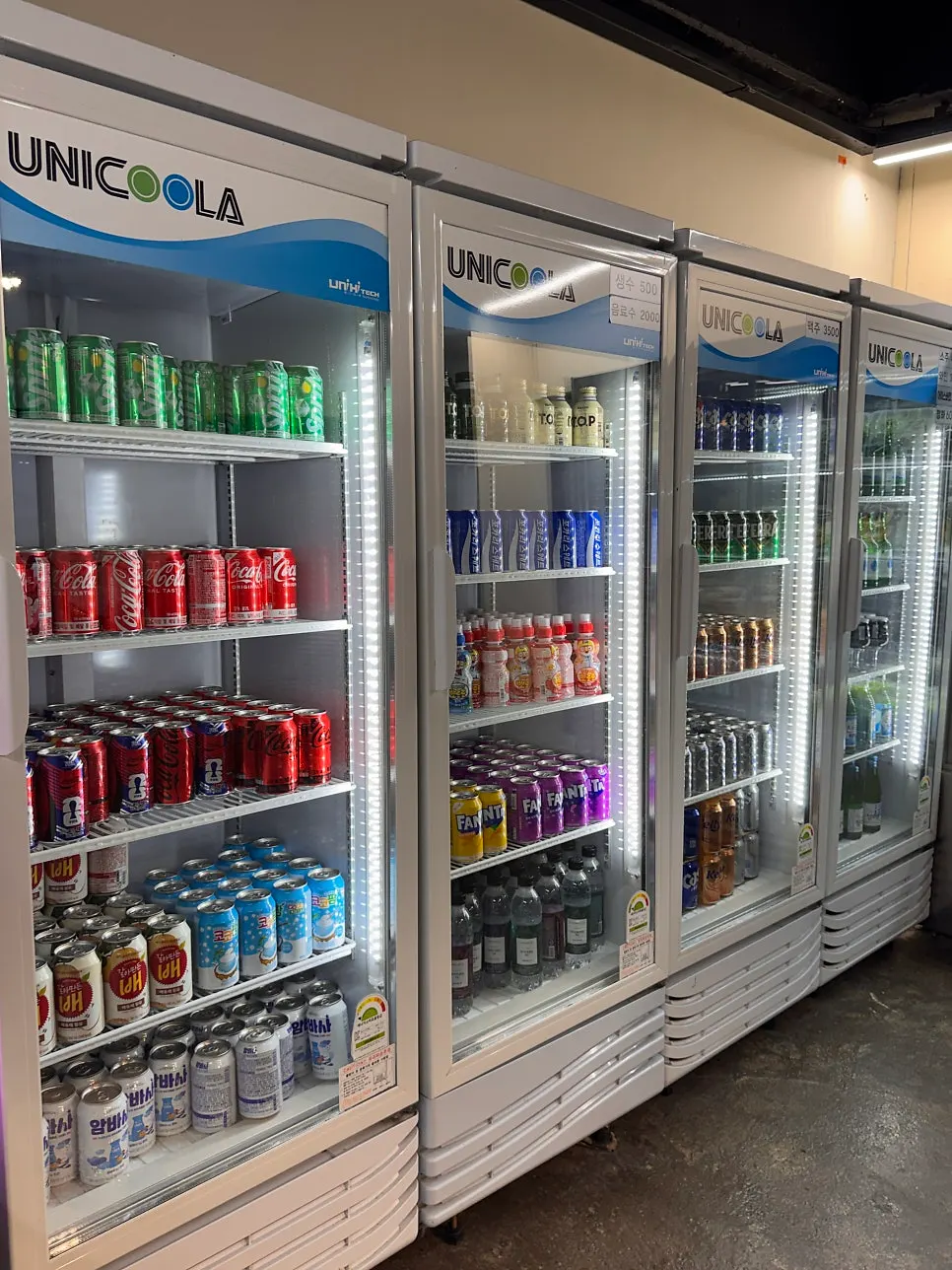 Store fridge stocked with alcohol and drinks