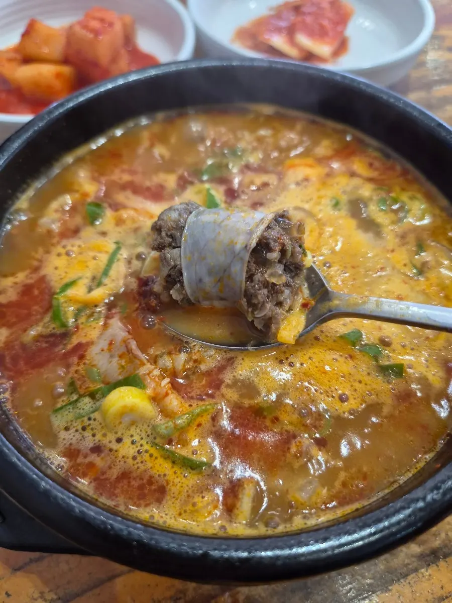 A bowl of spicy sundae-guk packed with toppings