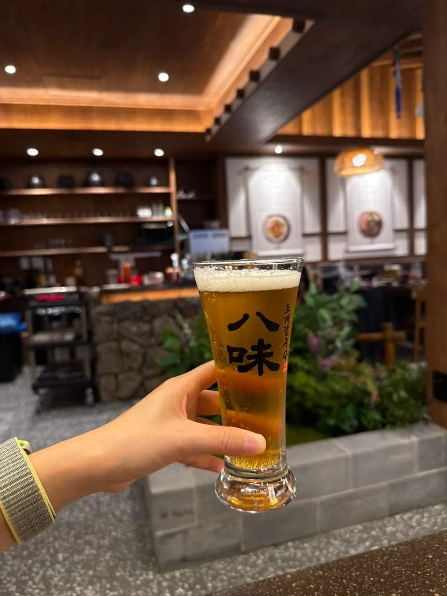 A cold beer ordered to finish the meal