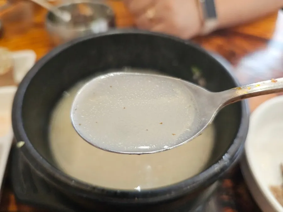 A bite of sundae-guk with sundae and rice together