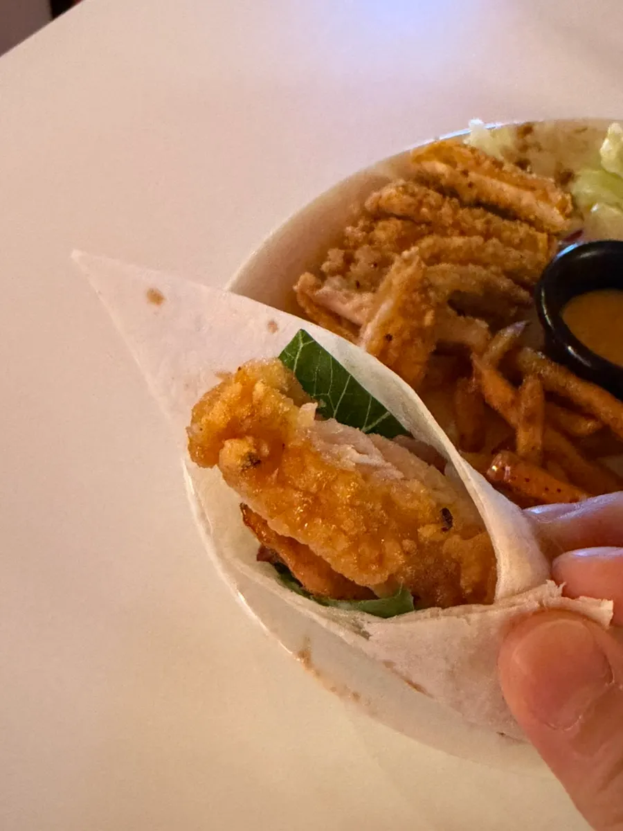 Chicken tortilla wrap dipped into buldak gnocchi sauce