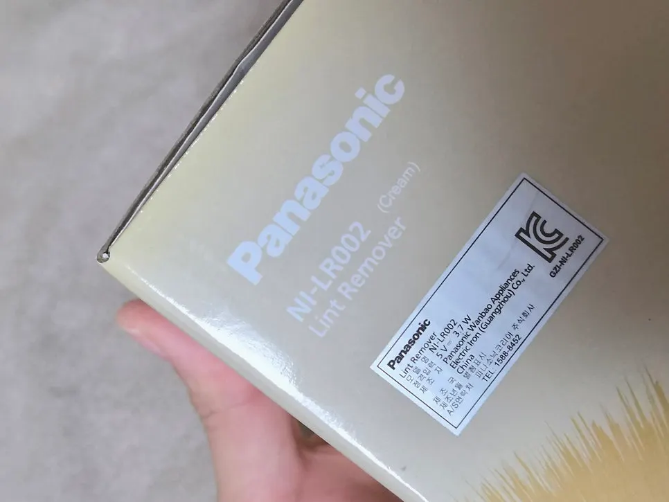 Panasonic lint remover in use for winter clothing care
