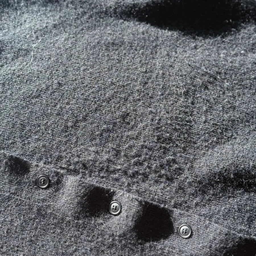 Before-and-after comparison of pilling removal on a black knit dress