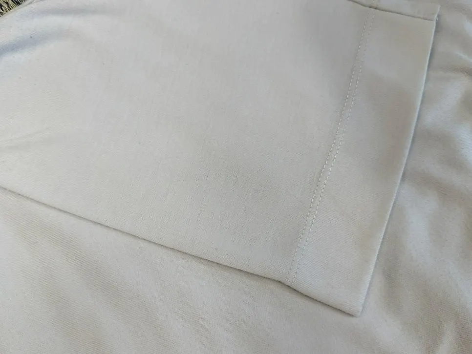 Before-and-after comparison of pill care on a white T-shirt