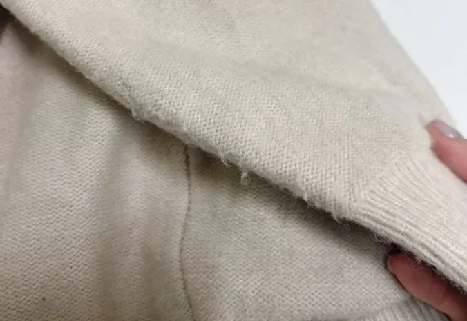 Upper-arm area of a knit with friction-related pilling