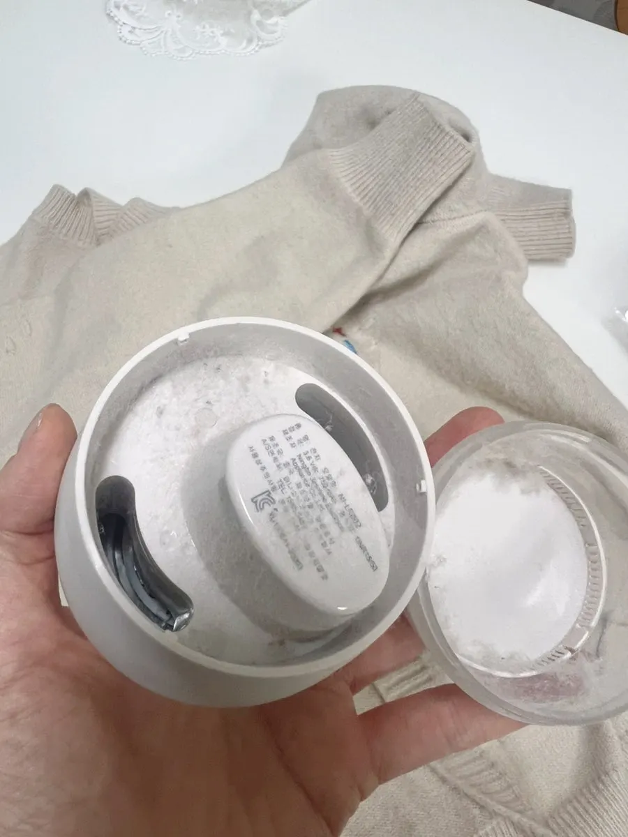 Emptying the lint bin after use