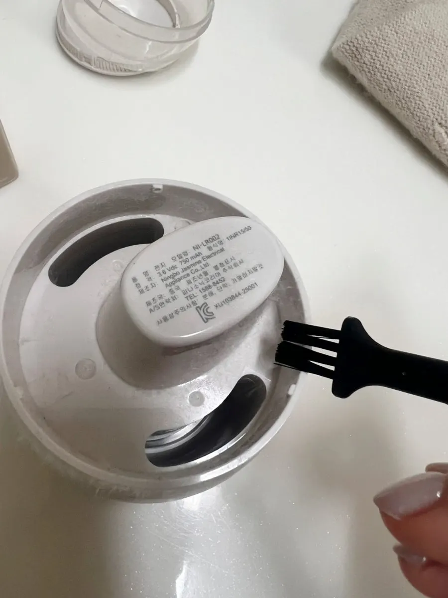 Putting away the lint remover after knit care