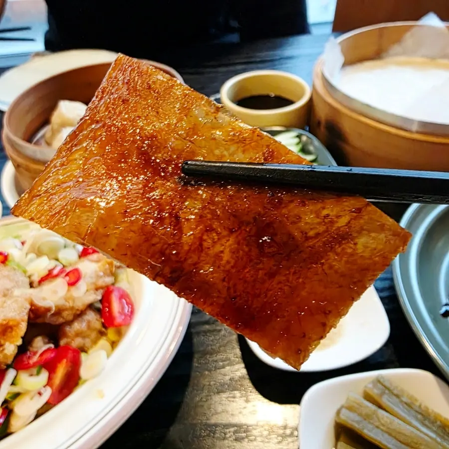 Peking duck meat showing the roasted skin