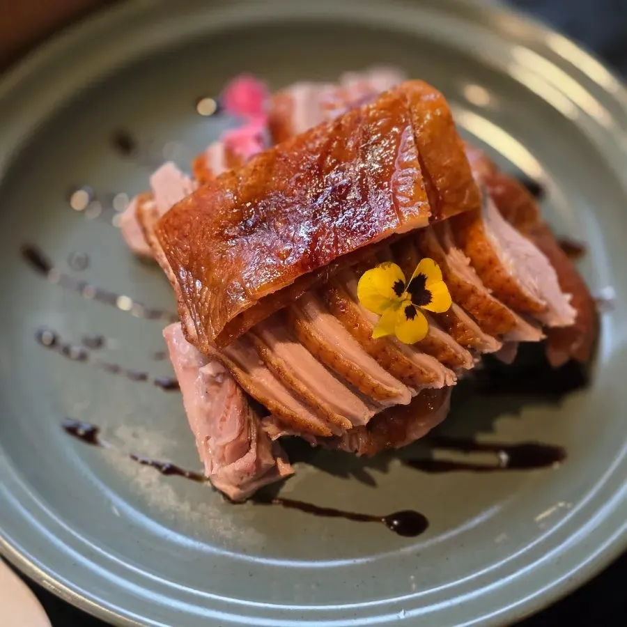 Half Peking duck set served alongside dim sum