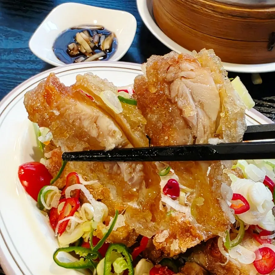 A piece of crispy yurinji with sauce on the side