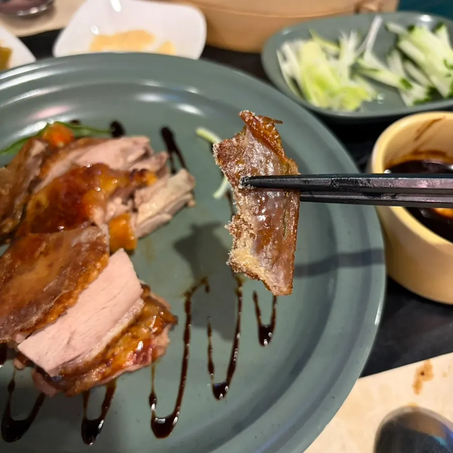 Crispy duck skin dipped in sugar