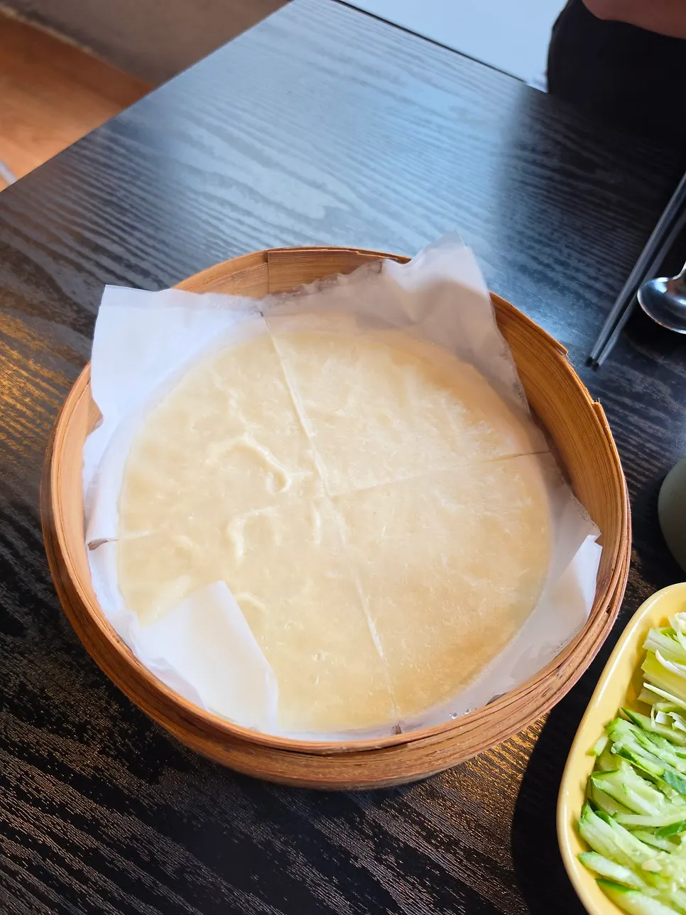 Peking duck pancakes separated with parchment paper