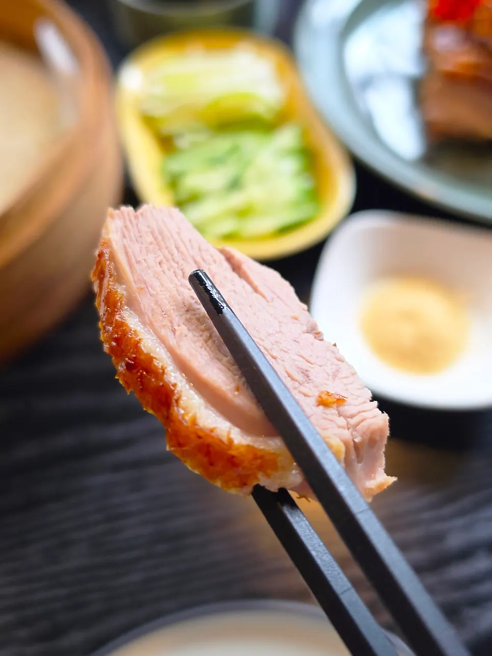 A piece of Peking duck showing its crispy skin