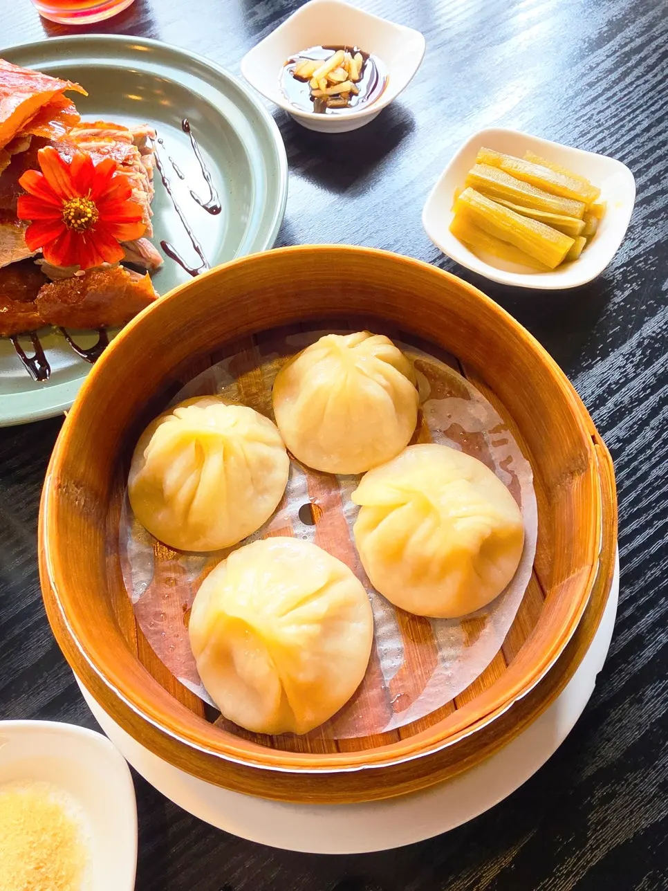 Four pieces of xiaolongbao at Panda Dim Sum