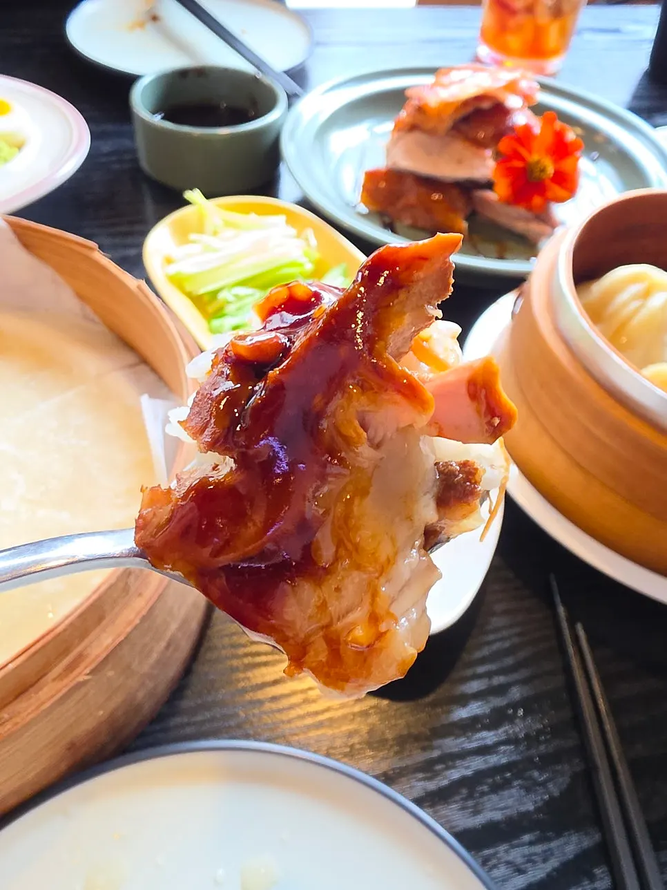 A piece of dongpo pork topped with wasabi