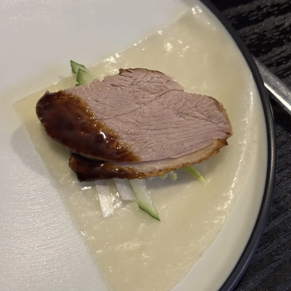A moist piece of Peking duck meat