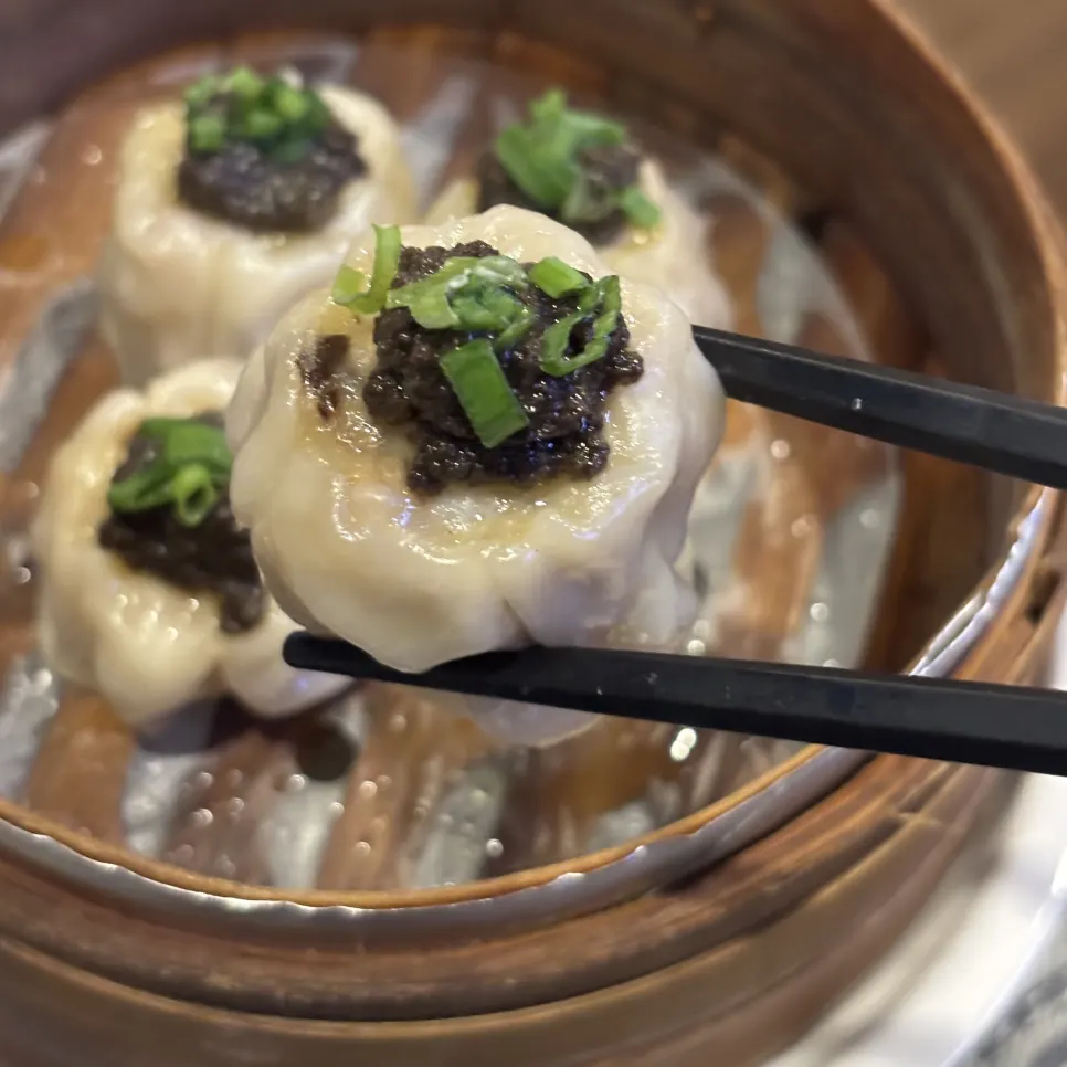 Cross-section of a truffle shumai bitten in half