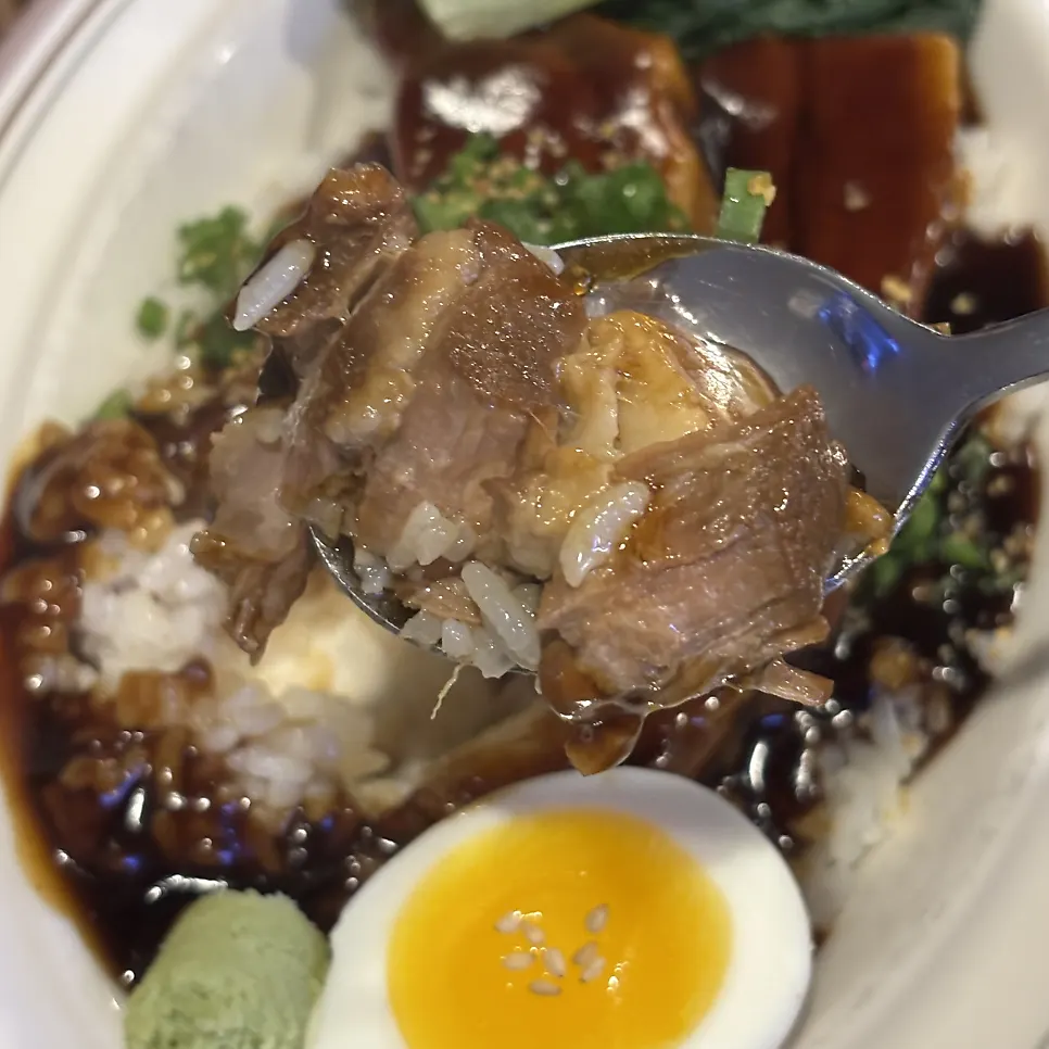 A thickly sliced piece of braised pork