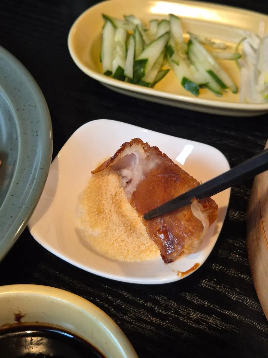 Half Peking duck topped with a flower garnish at Panda Dim Sum