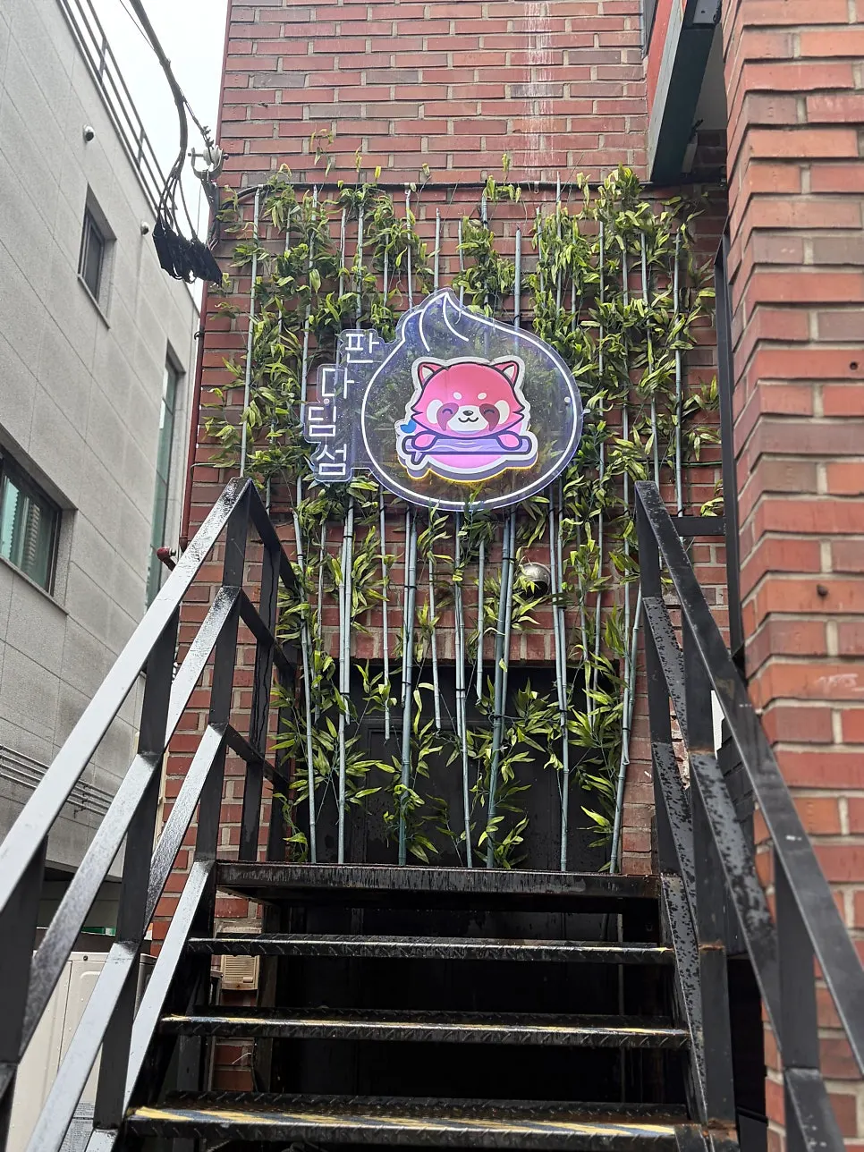 Entrance of Panda Dim Sum with the panda sign