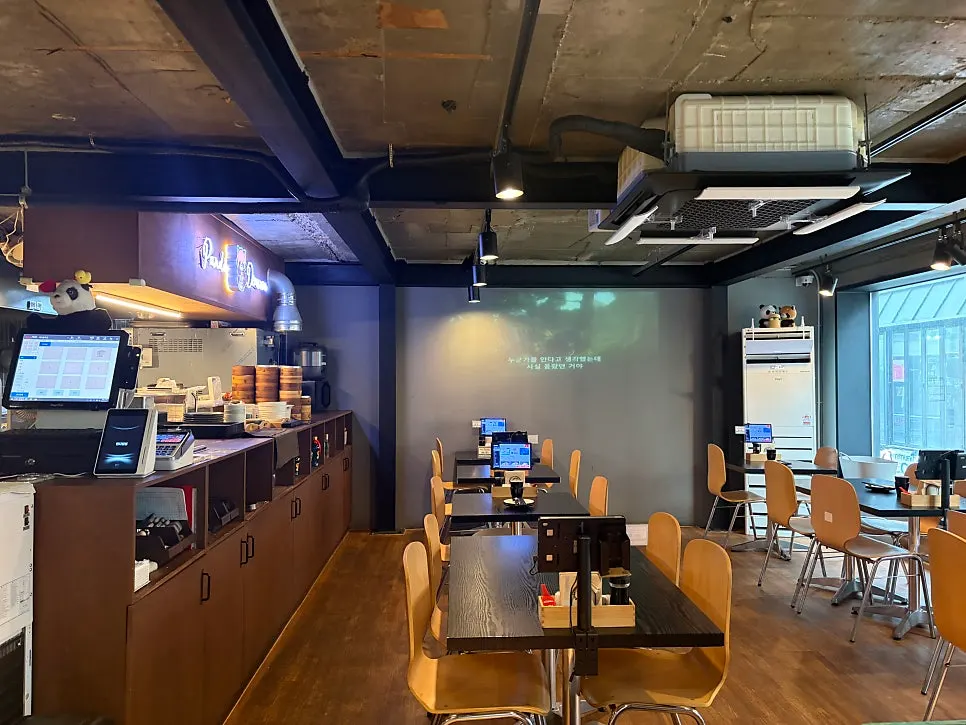 Dining hall with the open kitchen visible at Panda Dim Sum