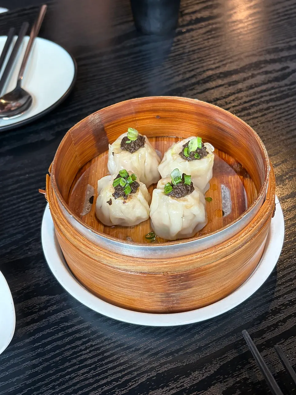 Cross-section of truffle shumai showing plump shrimp filling