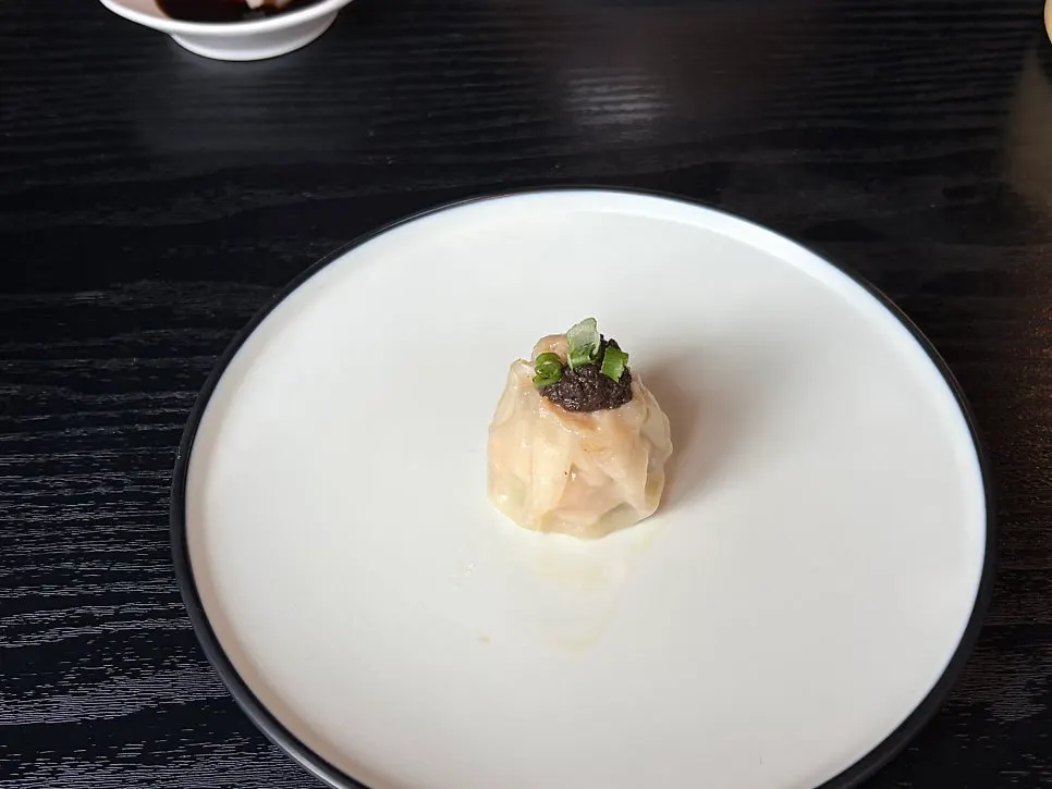 Truffle shumai served with soy sauce and ginger