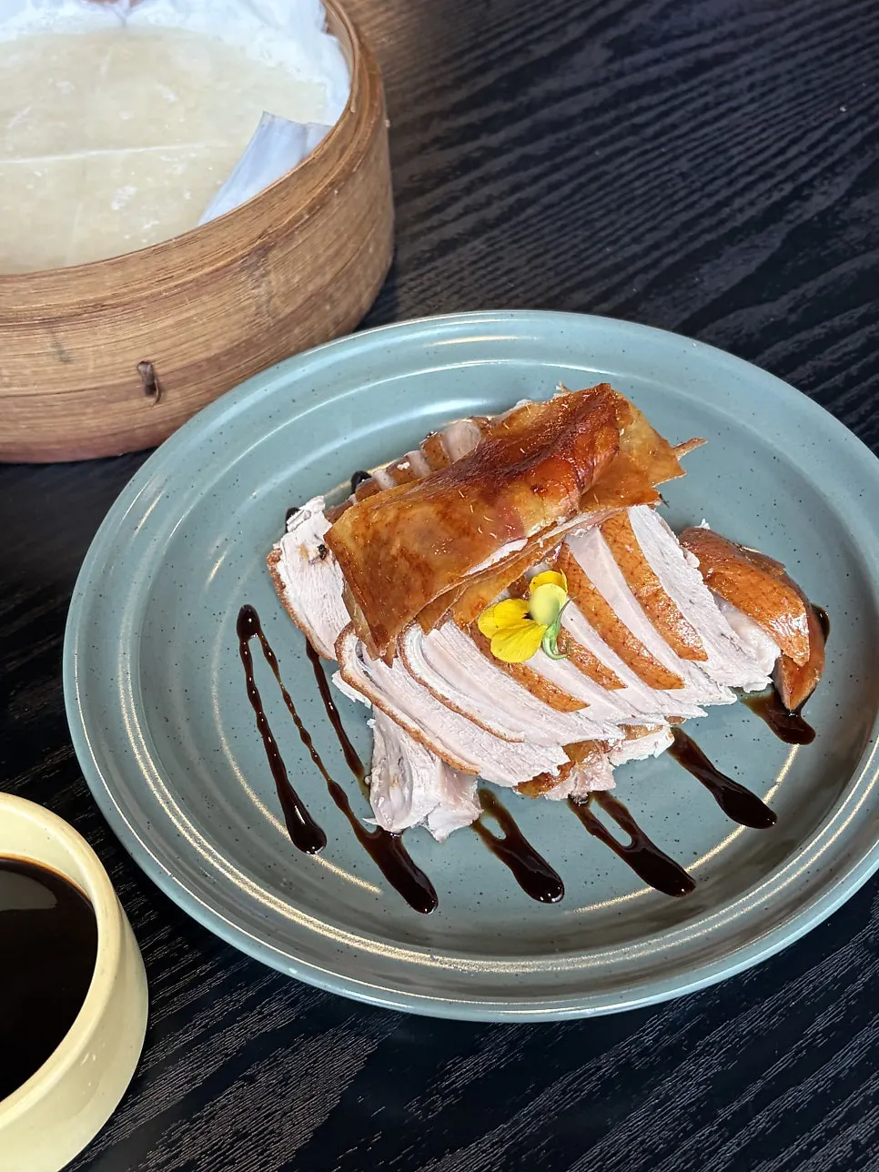 Table setup with Panda Dim Sum's half Peking duck