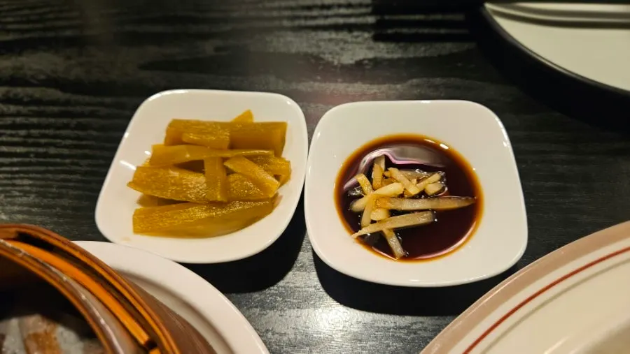 Flying fish roe shumai served in a steamer basket