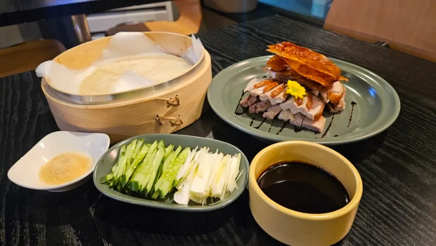 Peking duck wrap rolled up in a wheat pancake