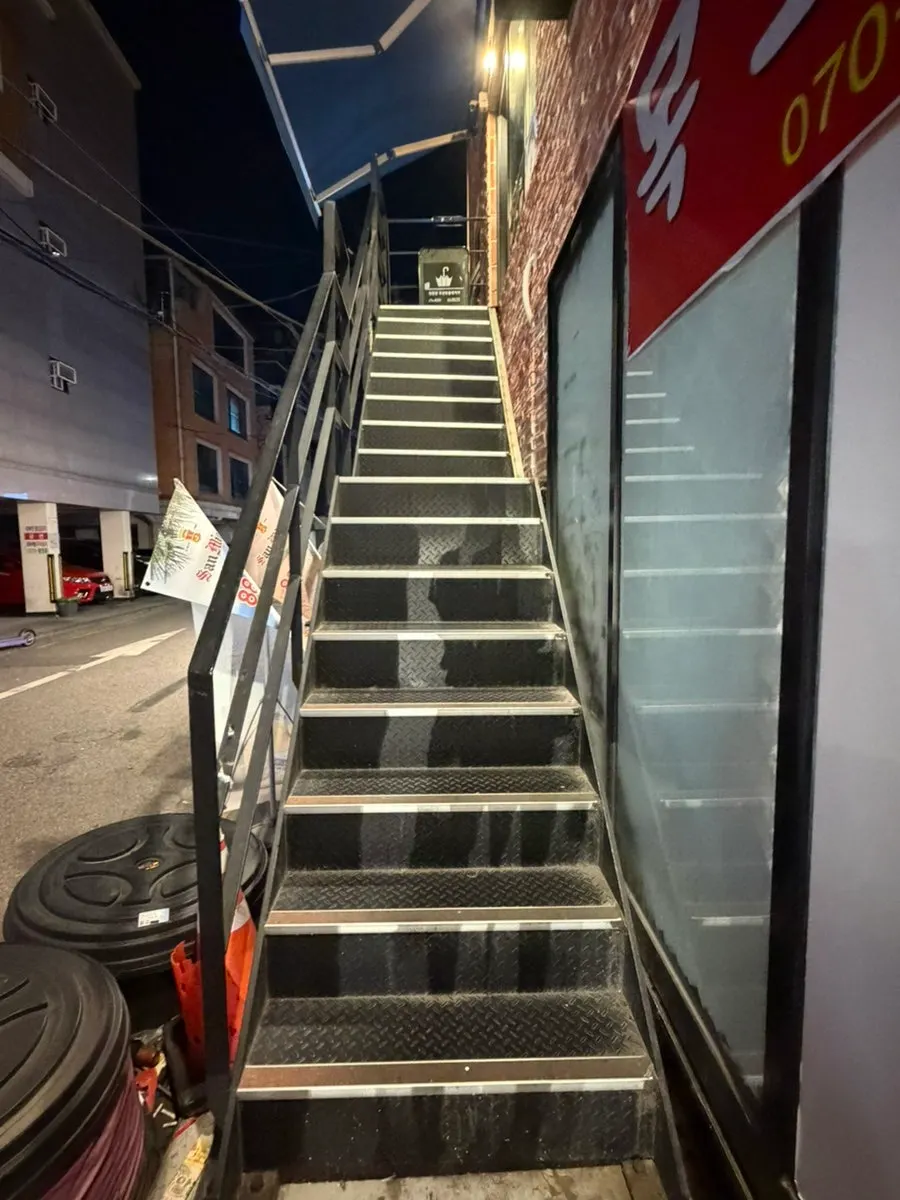 Staircase leading up to the 2nd-floor shop
