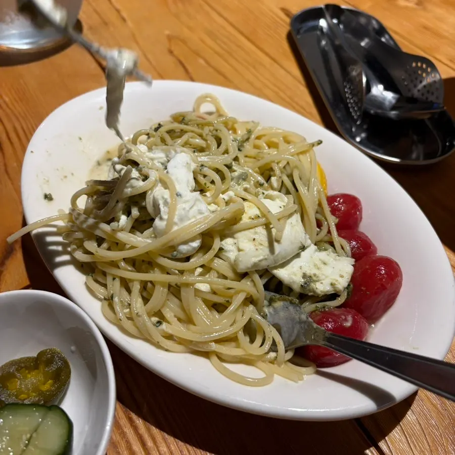 Basil cold pasta lifted on a fork