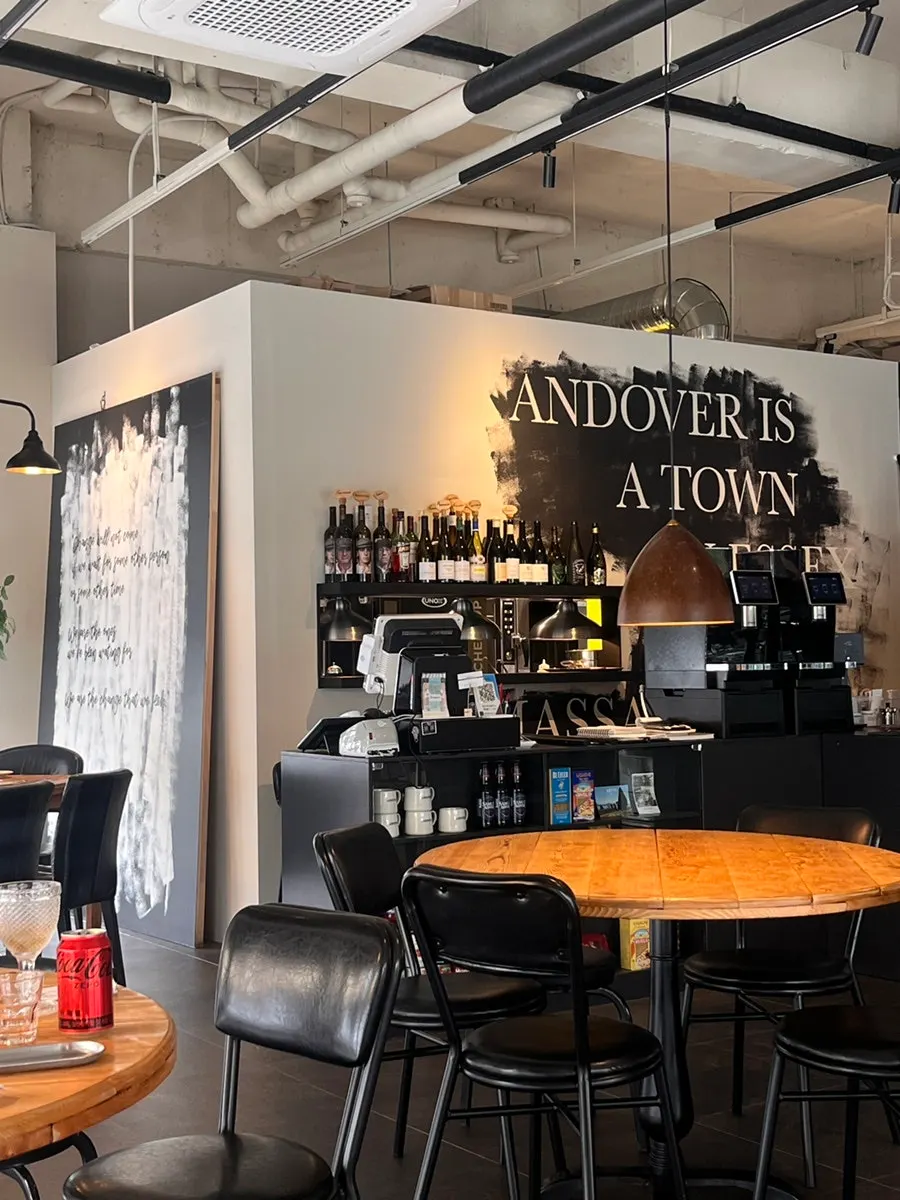 Table marked as reserved with a wine bottle