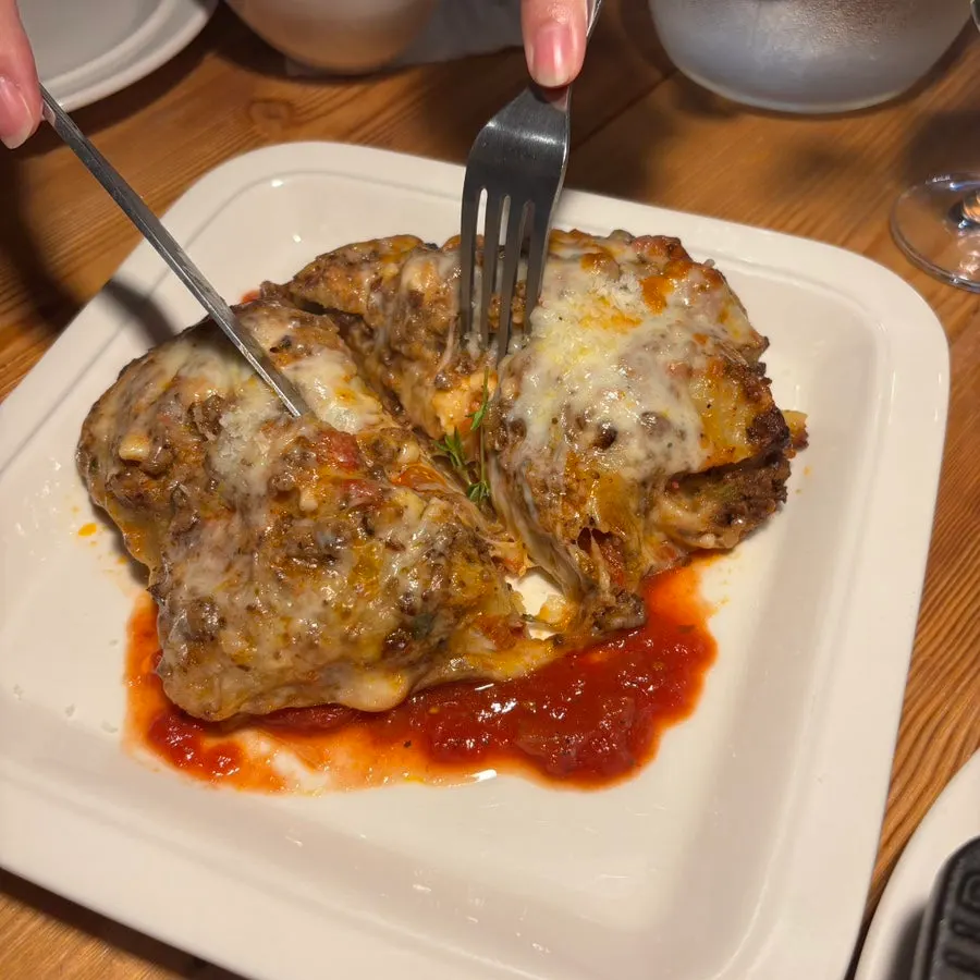 Lasagna filled generously with ragù sauce