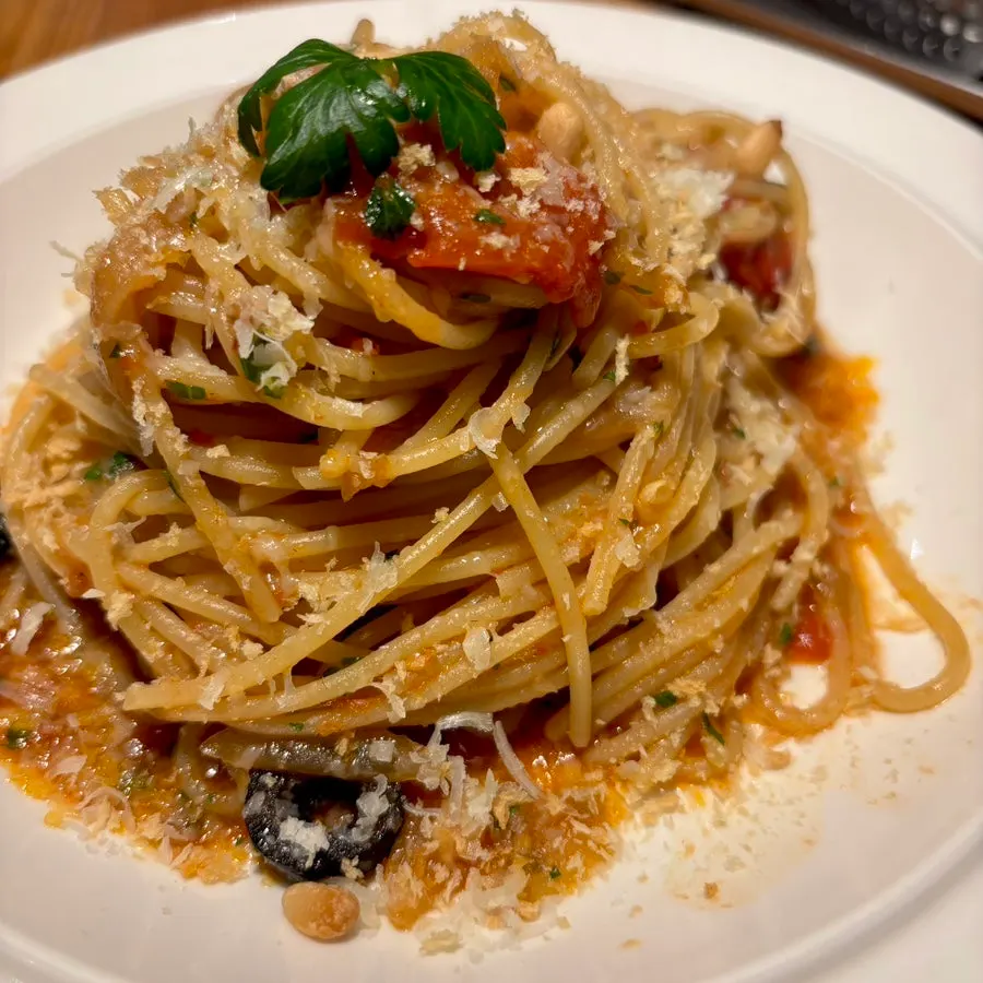 Pasta with pine nuts and black olives